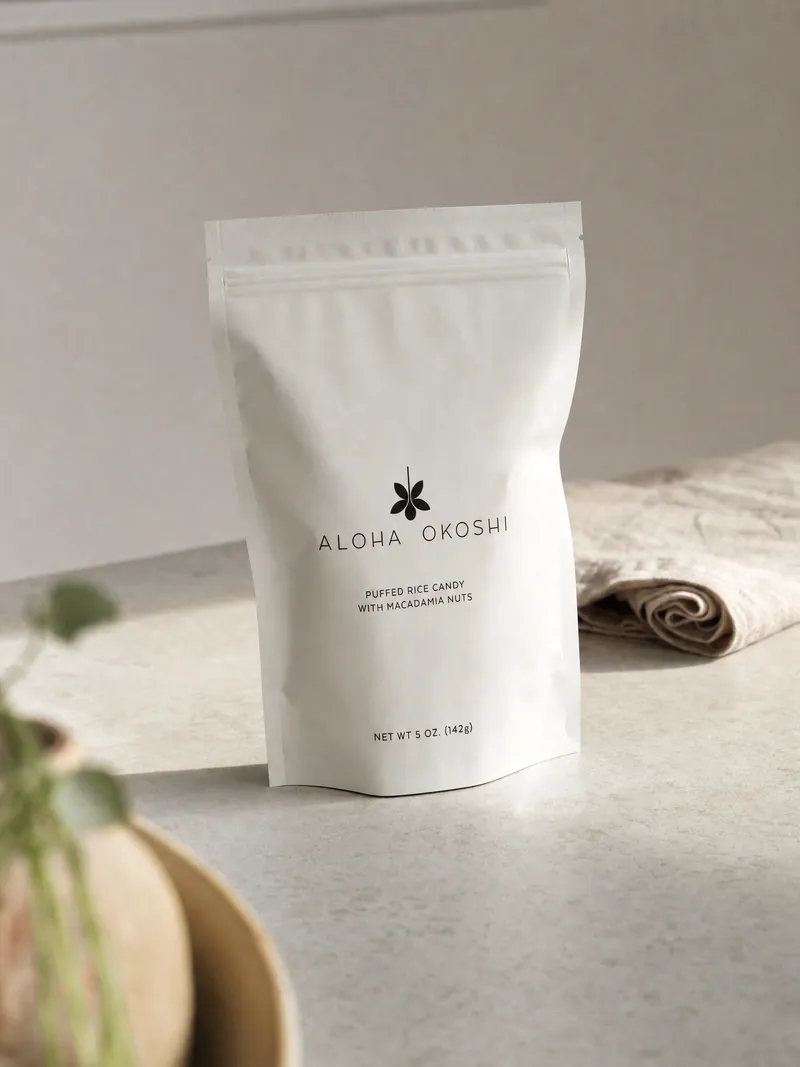 The bag on a pale concrete counter, a rolled linen towel behind it